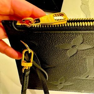 Authentic, never used Neverfull Empreinte Monogram Pochette Wristlet Pouch Black